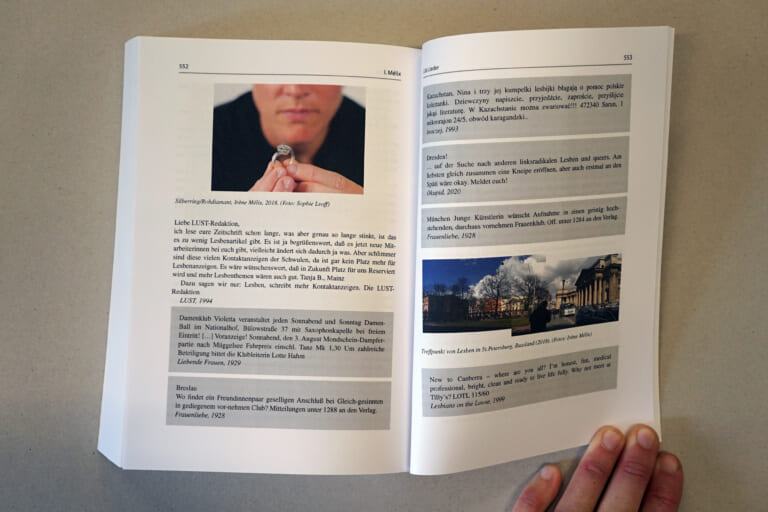 Opened double page of the book, again held by a hand on the right. Text blocks with and without gray background on both sides, top left a photograph of two hands holding a silver ring, behind them blurred a face. On the right, an image composed of two photographs of a public square with trees and buildings, and blue sky with some clouds.